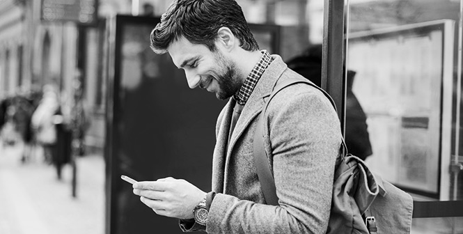Young man on a smartphone in the city