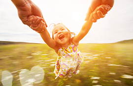 Girl spinning around with her dad