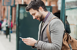 Young man with a smartphone in the city