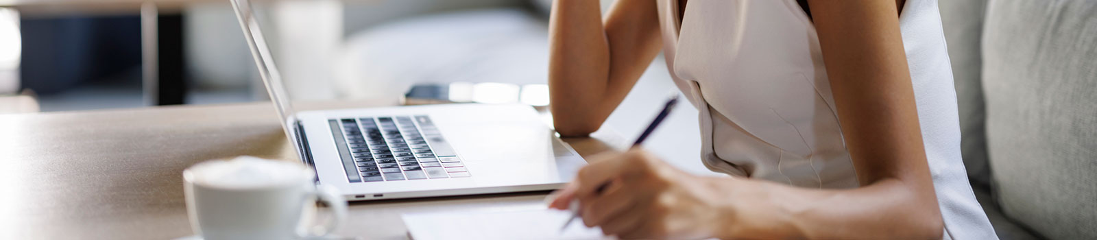 Woman using laptop in home office